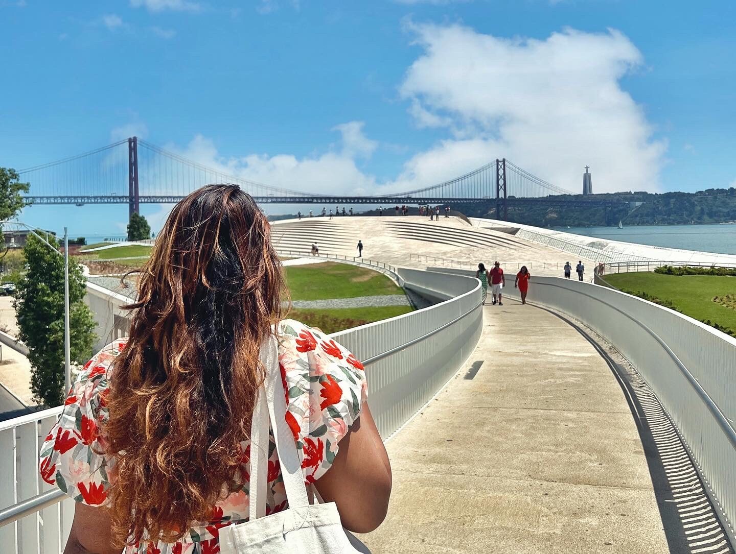 Tia walking along the MAAT boardwalk in Lisbon