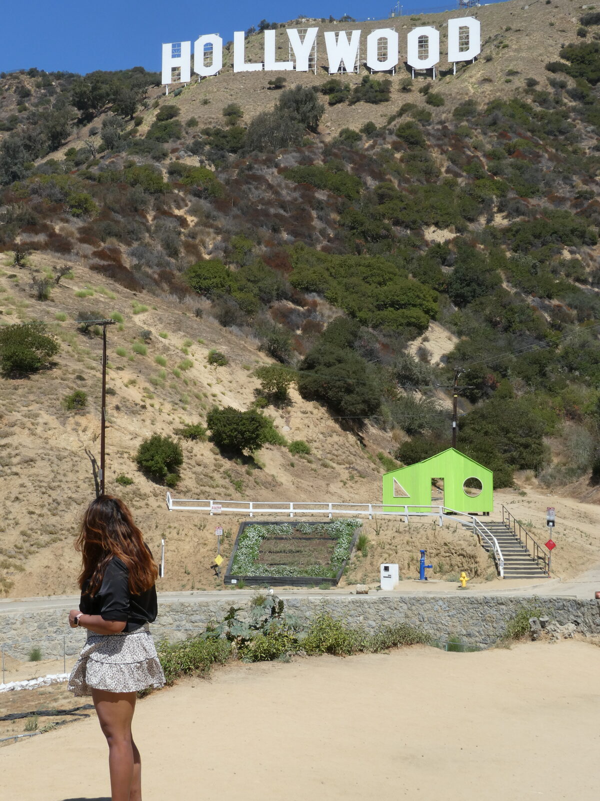 Tia in front of the Hollywood sign