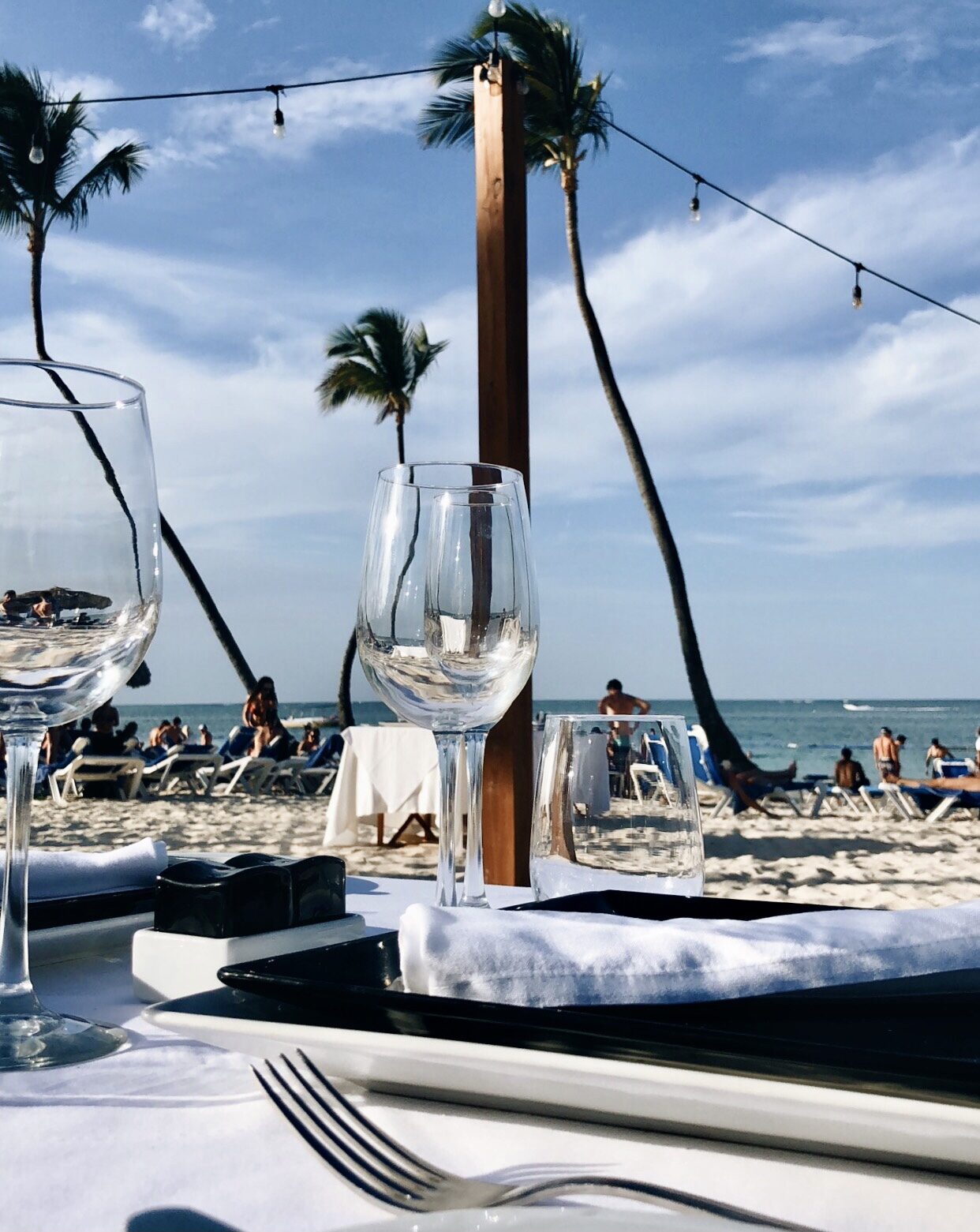 Beachside table setting with palm trees, Punta Cana